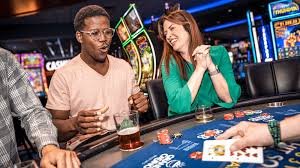 Dealer executing Phoenix Rises hand at live table